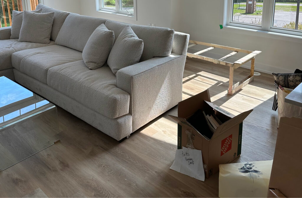 New furniture and moving boxes in a new home