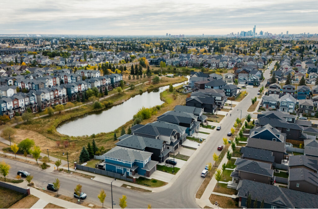 Aerial view of the Village at Griesbach with Downtown Edmonton in the background