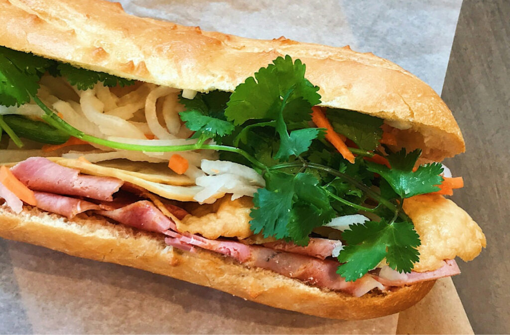 A close up of a bahn mi sub sandwich